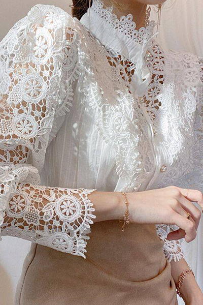 Elegant women's blouse with embroidered openwork details