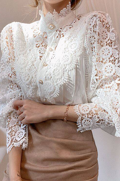 Elegant women's blouse with embroidered openwork details