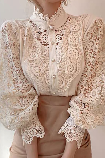 Elegant women's blouse with embroidered openwork details