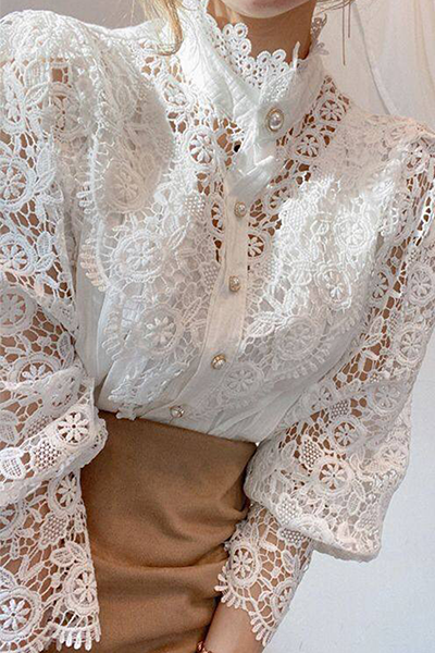 Elegant women's blouse with embroidered openwork details