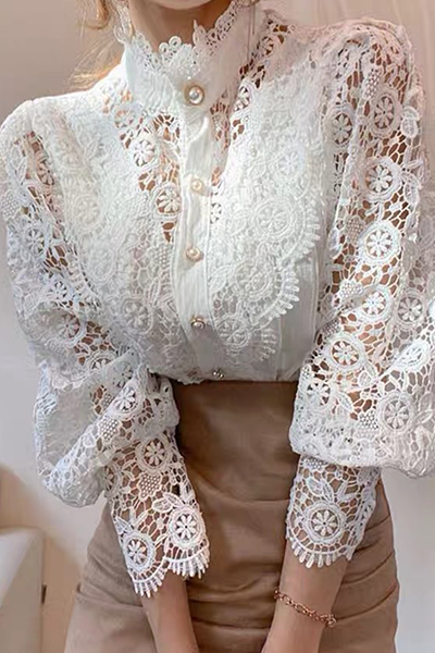 Elegant women's blouse with embroidered openwork details