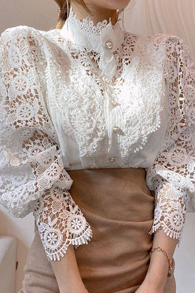 Elegant women's blouse with embroidered openwork details