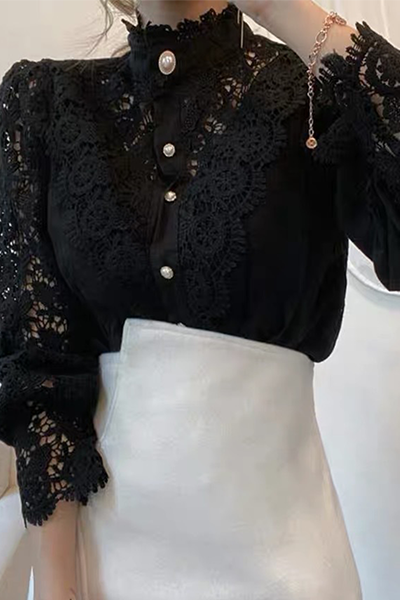 Elegant women's blouse with embroidered openwork details