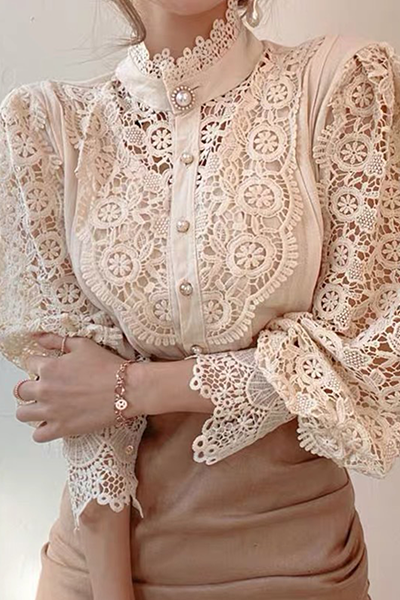 Elegant women's blouse with embroidered openwork details