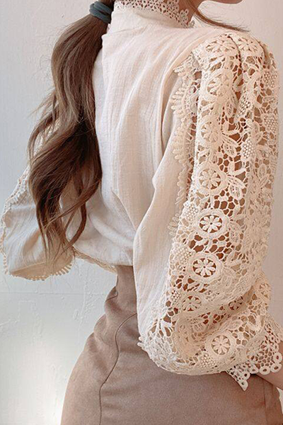 Elegant women's blouse with embroidered openwork details