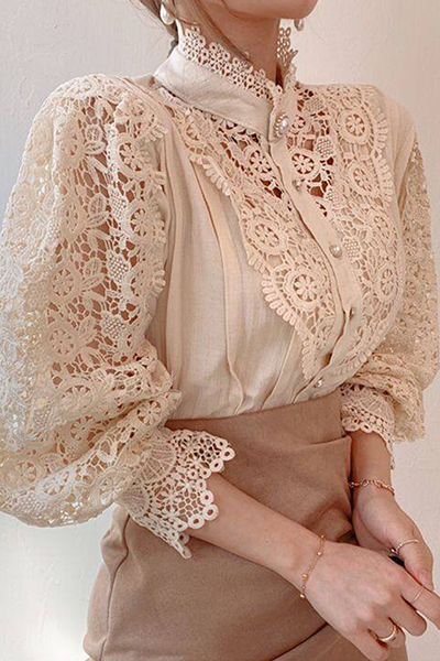 Elegant women's blouse with embroidered openwork details