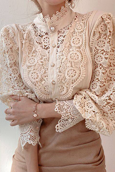 Elegant women's blouse with embroidered openwork details