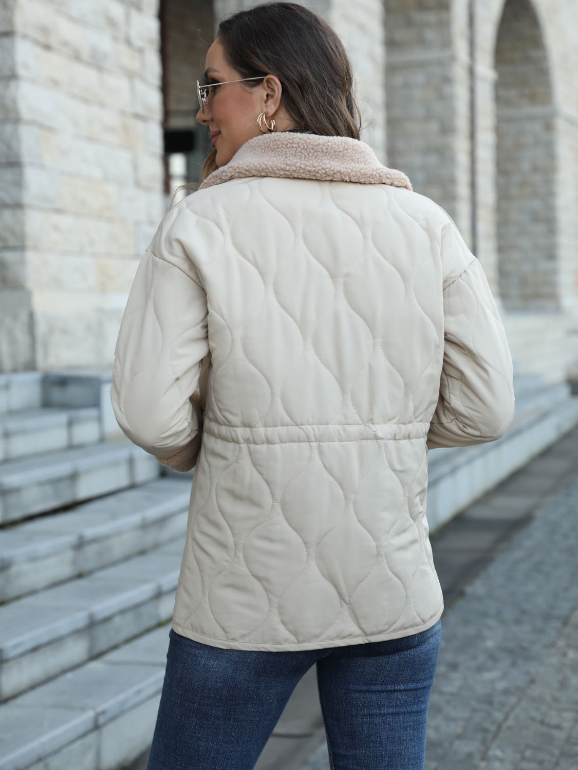 Women's jacket with collar and snap button closure