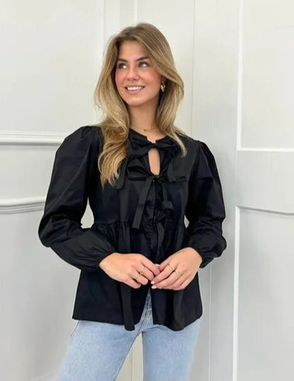 Women's blouse with puff sleeves and bow detail