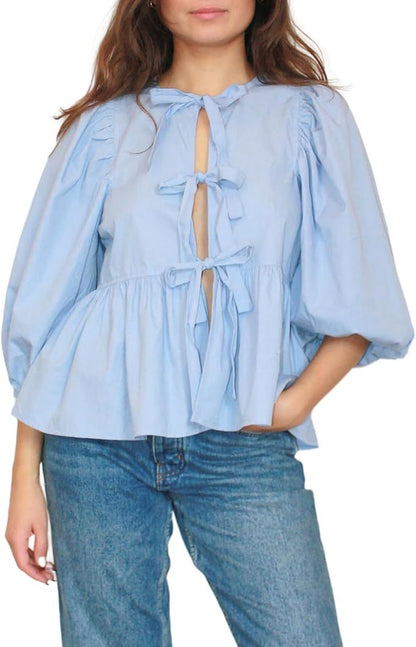 Women's blouse with puff sleeves and bow detail