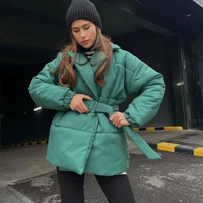 Stylish women's padded winter overcoat with belt and sophisticated collar