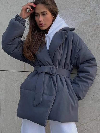 Stylish women's padded winter overcoat with belt and sophisticated collar