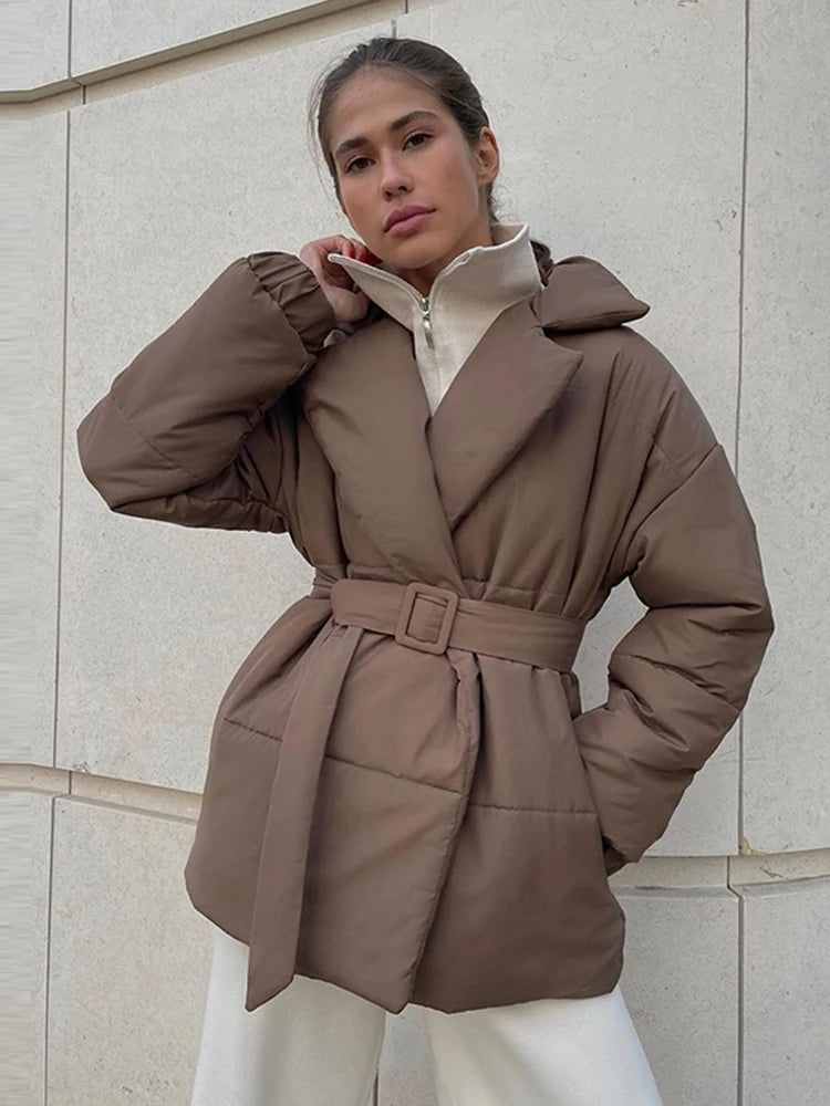 Stylish women's padded winter overcoat with belt and sophisticated collar