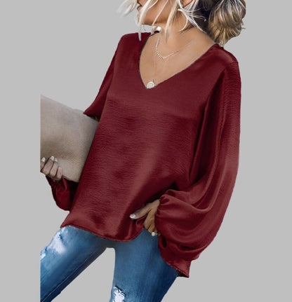 Women's satin blouse with v-neck and lantern sleeves