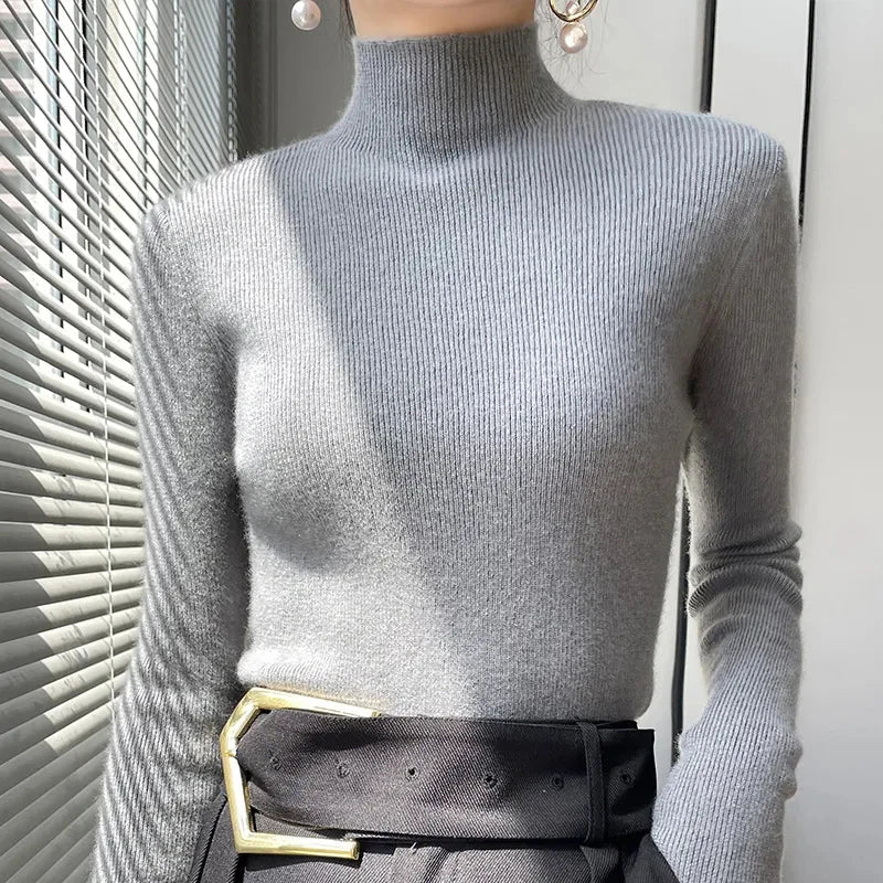 Women's knit sweater with half turtleneck and long sleeves