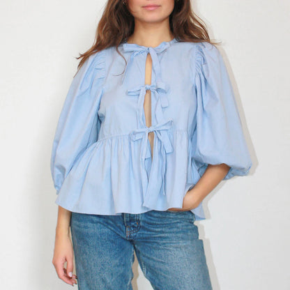 Women's blouse with puff sleeves and bow detail